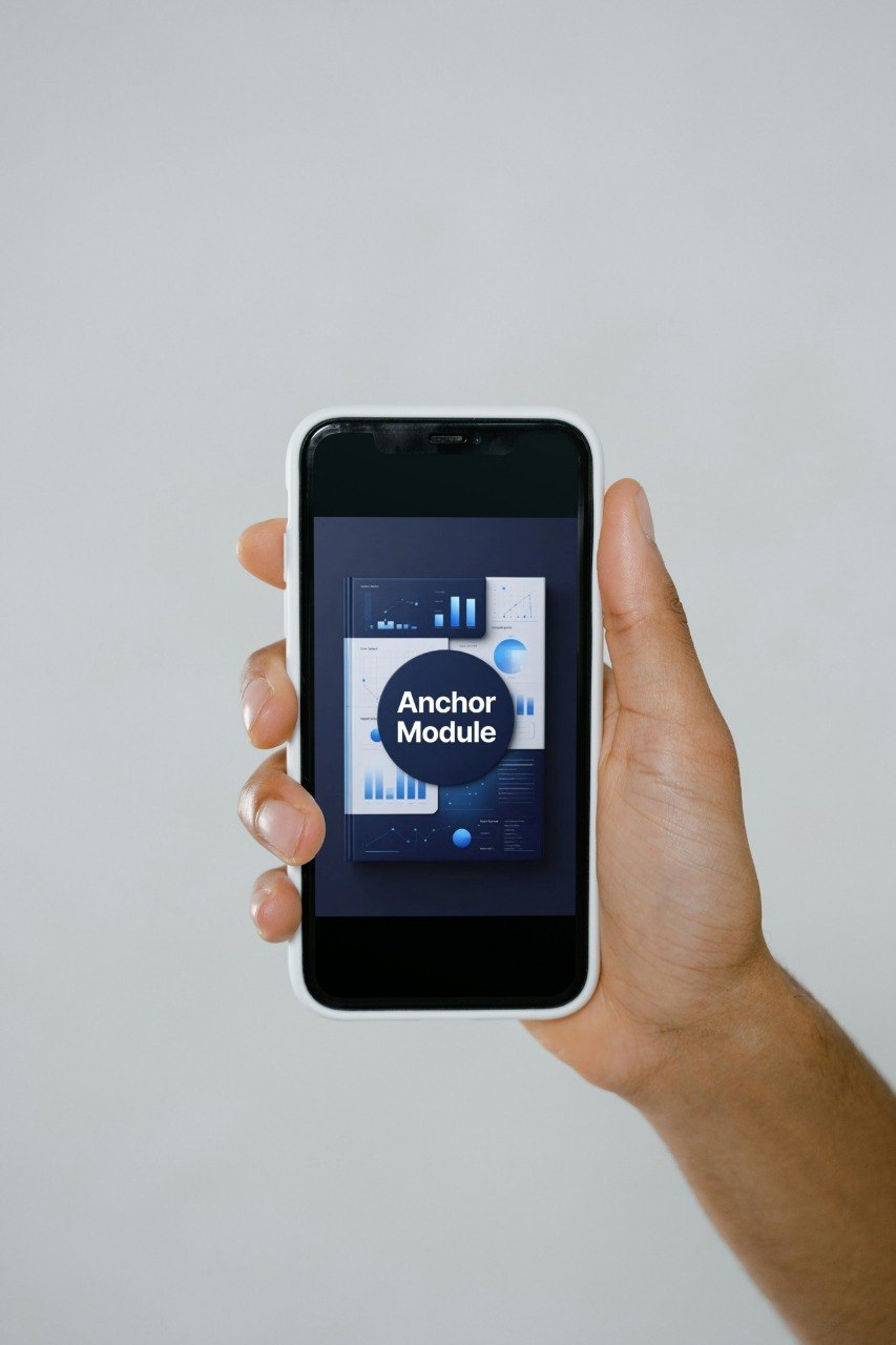 Hand holding a smartphone with an app interface on a plain background