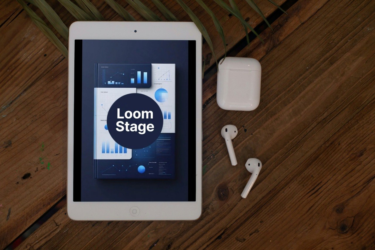 Tablet displaying 'Loom Stage' app on a wooden surface with AirPods.