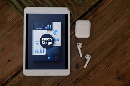 Tablet displaying 'Neon Stage' app on a wooden surface with AirPods.